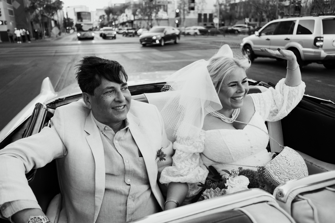 bride and groom being driven around