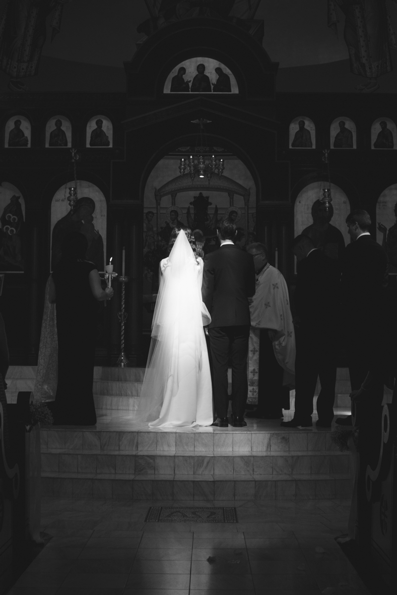 black and white photograph on married couple in greek orthodox church