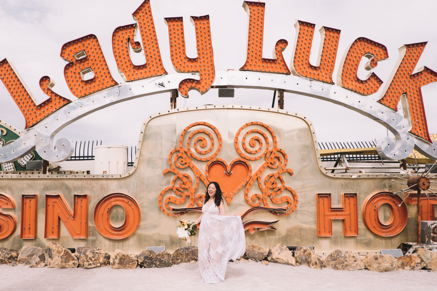 Bride in Front of lady Luck sign at The Neon Museum
