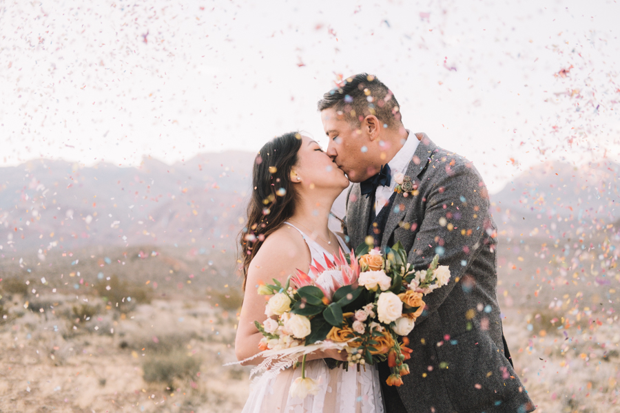 Bride & Groom kissing at Red Rock Canyon State Park with confetti thrown